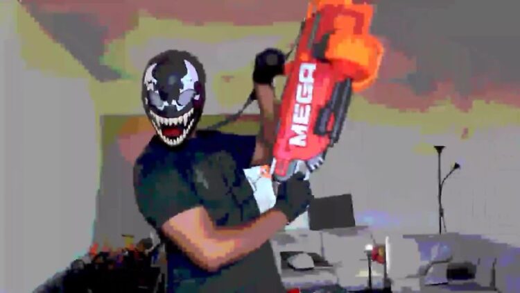 Blee holds the Nerf Mega Mastodon and gets carried away